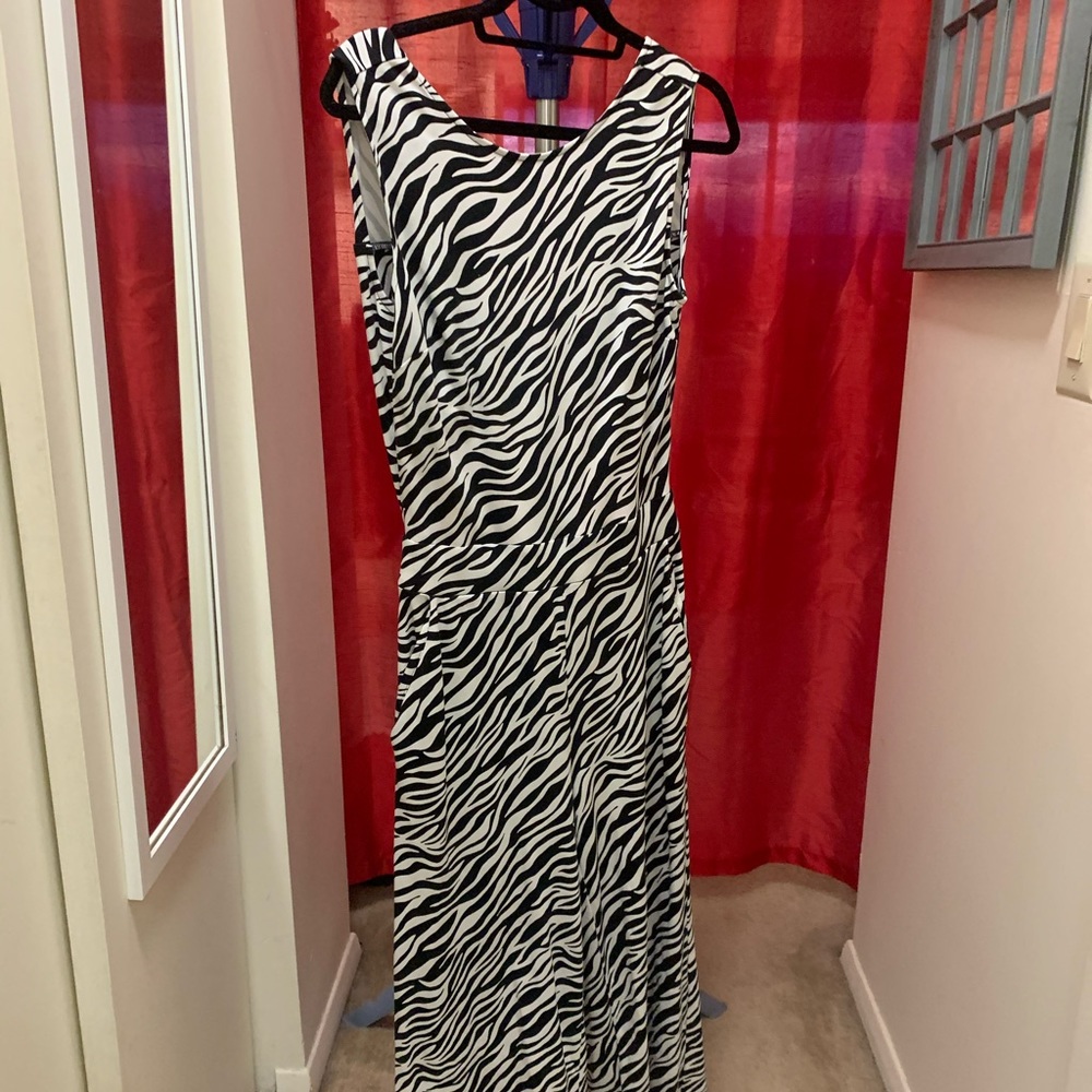 Zebra romper with open back.